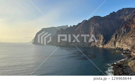 Experience the breathtaking coastal cliffs alongside serene ocean views that captivate the soul 129968644