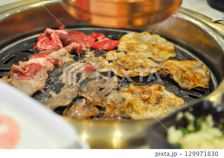 barbecued beef or grilled beef and grilled pork on the broiler or Korean bbq barbecued beef or grilled beef and grilled pork on the broiler or Korean bbq 129971830