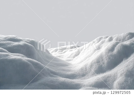 Beautiful snowdrift isolated on white background. Winter snow background. A big snow drift 129972505