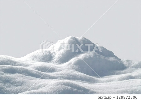 Beautiful snowdrift isolated on white background. Winter snow background. A big snow drift Beautiful snowdrift isolated on white background. Winter snow background. A big snow drift 129972506