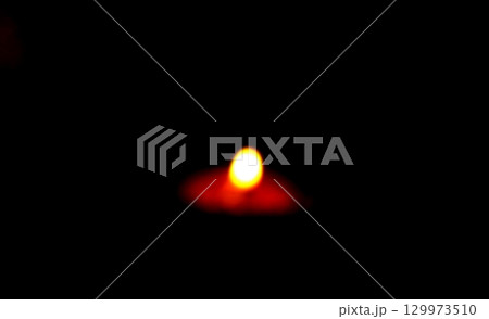 Blurred Burning Clay Oil Lamp in Darkness 129973510