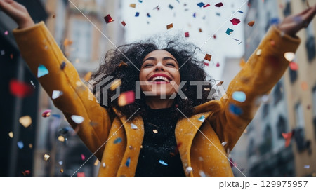 Vibrant New Year Celebration on City Streets with Crowds Cheering and Fireworks Vibrant New Year Celebration on City Streets with Crowds Cheering and Fireworks 129975957