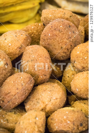 Aromatic falafel balls with chickpeas and vegetables. Vegetarian dish Aromatic falafel balls with chickpeas and vegetables. Vegetarian dish 129976127