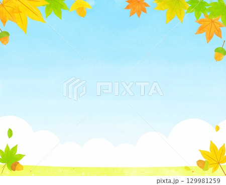 紅葉とどんぐりが賑やかな雰囲気の爽やかな青空背景の秋のフレーム 129981259