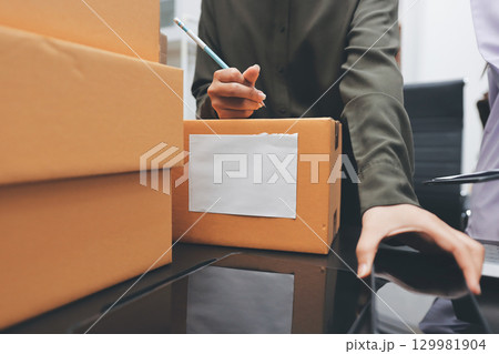 Portrait of Starting small businesses SME owners, two Asian woman check online orders Selling products working with boxs freelance work at home office, sme business online small medium enterprise Portrait of Starting small businesses SME owners, two Asian woman check online orders Selling products working with boxs freelance work at home office, sme business online small medium enterprise 129981904