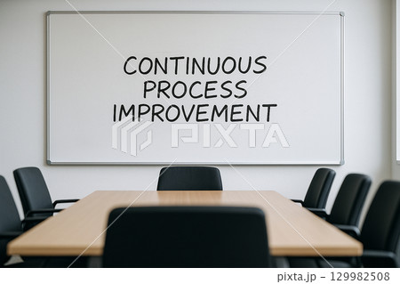 Continuous Process Improvement text on white board in an office meeting settings Continuous Process Improvement text on white board in an office meeting settings 129982508