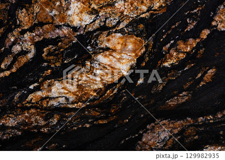 Black Magma granite texture in attractive dark color. 129982935
