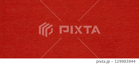 A deep crimson felt surface. Seamless texture. A deep crimson felt surface. Seamless texture. 129983944