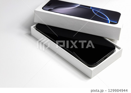 Brand new smartphone in retail box Brand new smartphone in retail box 129984944
