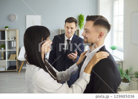 Manager confronts affectionate couple amid suspected office cheating and infidelity 129985036