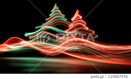 Abstract light painting of two Christmas trees with vibrant red and green trails on dark background 129987056
