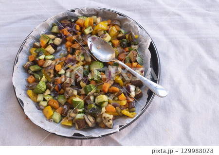 roasted vegetable medley with spoon 129988028