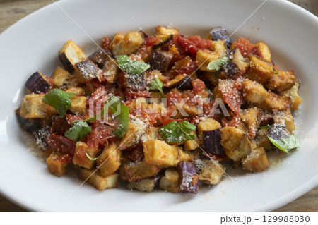 roasted eggplant salad with tomatoes parmesan cheese fresh basil mediterranean dish 129988030