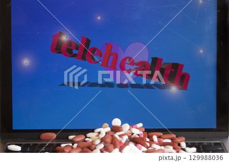 telehealth on laptop with pills telehealth on laptop with pills 129988036