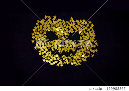 Happy Thanksgiving Day, give thanks, autumn gold glitter design. Posters with golden pumpkin silhouette from stars glitter. 129988865