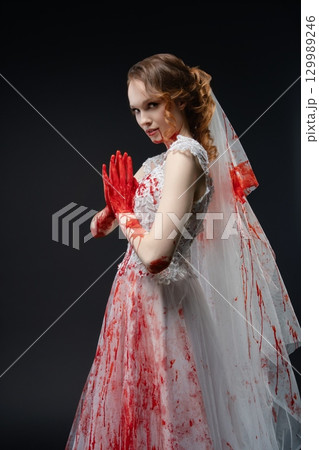 Bride in bloody lingerie with katana evokes dark beauty and mystery Bride in bloody lingerie with katana evokes dark beauty and mystery 129989246