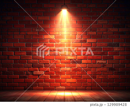 上からのスポットライトが照らす赤レンガの壁 上からのスポットライトが照らす赤レンガの壁 129989428
