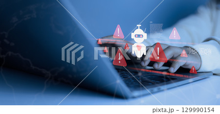 Hands typing on laptop with AI robot icon and warning alerts, concept of cybersecurity threat, malware attack, artificial intelligence risk, and online data protection. 129990154