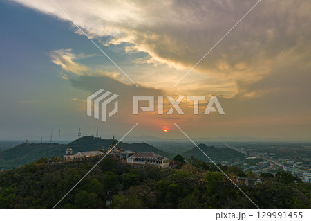 aerial view beautiful sunset above the palace in Phetchaburi city on hilltop. aerial view beautiful sunset above the palace in Phetchaburi city on hilltop. 129991455