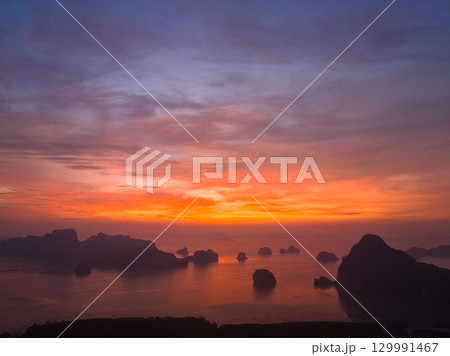Imagine the beautiful bright red sky at sunrise from a bird's eye view. Imagine the beautiful bright red sky at sunrise from a bird's eye view. 129991467