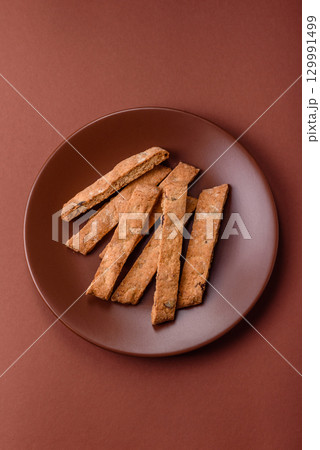 Biscotti or cantuccini biscuits, a crispy sweet Italian pastry. Biscotti dessert Biscotti or cantuccini biscuits, a crispy sweet Italian pastry. Biscotti dessert 129991499