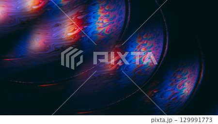 Fluorescent liquid blur. Psychedelic chemical ink. Colorful defocused round lens flow swirl blending dye abstract glow black background. 129991773