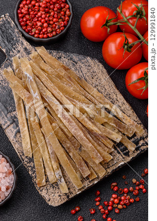 Food, snacks or jerky made from dried dehydrated salted fish with spices. Snacks fish 129991840