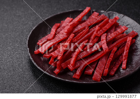 Jerky or dried chicken and cherry snacks. Dehydrated, dried snacks for beer Jerky or dried chicken and cherry snacks. Dehydrated, dried snacks for beer 129991877