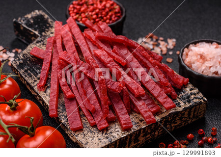 Jerky or dried chicken and cherry snacks. Dehydrated, dried snacks for beer Jerky or dried chicken and cherry snacks. Dehydrated, dried snacks for beer 129991893