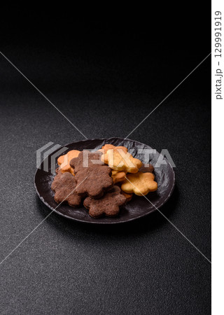 Sweet crispy biscuit with cocoa flavor, baking at home. Biscuit as a dessert Sweet crispy biscuit with cocoa flavor, baking at home. Biscuit as a dessert 129991919