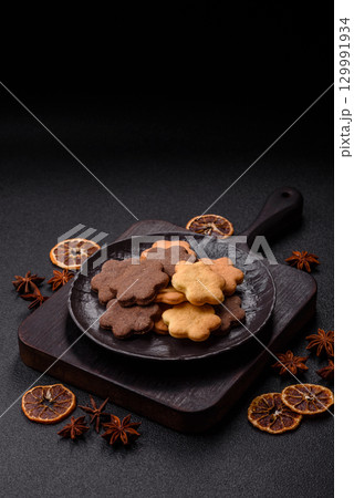 Sweet crispy biscuit with cocoa flavor, baking at home. Biscuit as a dessert Sweet crispy biscuit with cocoa flavor, baking at home. Biscuit as a dessert 129991934