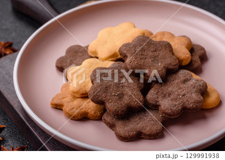 Sweet crispy biscuit with cocoa flavor, baking at home. Biscuit as a dessert Sweet crispy biscuit with cocoa flavor, baking at home. Biscuit as a dessert 129991938