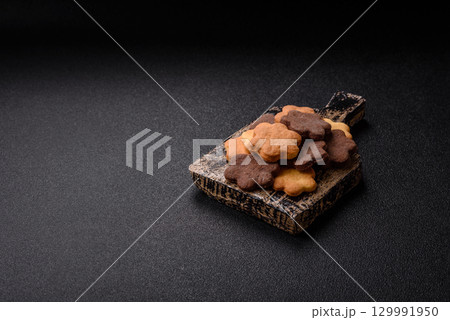Sweet crispy biscuit with cocoa flavor, baking at home. Biscuit as a dessert Sweet crispy biscuit with cocoa flavor, baking at home. Biscuit as a dessert 129991950
