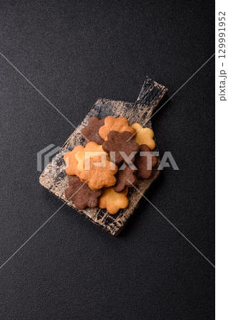 Sweet crispy biscuit with cocoa flavor, baking at home. Biscuit as a dessert Sweet crispy biscuit with cocoa flavor, baking at home. Biscuit as a dessert 129991952