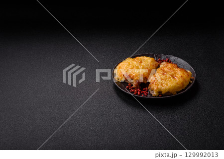 Steak, a pork or chicken chop covered with melted cheese. Grilled meat Steak, a pork or chicken chop covered with melted cheese. Grilled meat 129992013