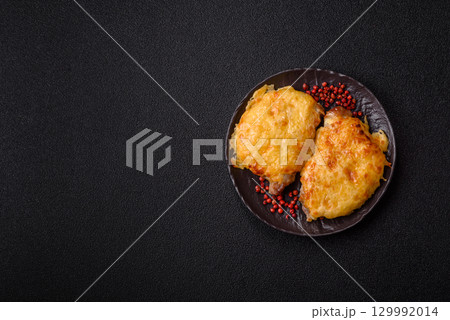 Steak, a pork or chicken chop covered with melted cheese. Grilled meat 129992014