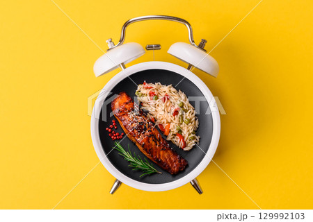 Red salmon fish grilled with pepper and spices. Concept time to eat fish 129992103
