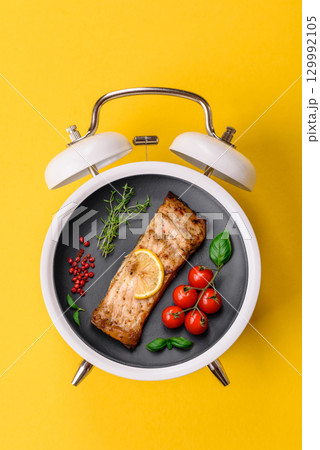 Red salmon fish grilled with pepper and spices. Concept time to eat fish 129992105