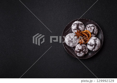 Chocolate crinkle cookies sprinkled with powdered sugar, homemade baking 129992129