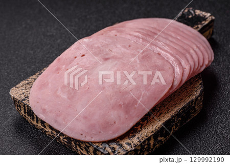 Sliced ham, meat or pork sausage for sandwiches. Cooked smoked prosciutto, ham 129992190