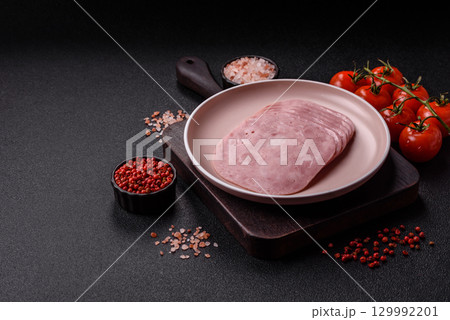 Sliced ham, meat or pork sausage for sandwiches. Cooked smoked prosciutto, ham Sliced ham, meat or pork sausage for sandwiches. Cooked smoked prosciutto, ham 129992201