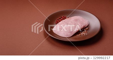 Sliced ham, meat or pork sausage for sandwiches. Cooked smoked prosciutto, ham 129992217