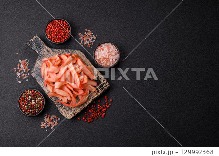 Food, dried squid in shavings or chopped as snacks or jerky. Snack dried squid for beer Food, dried squid in shavings or chopped as snacks or jerky. Snack dried squid for beer 129992368