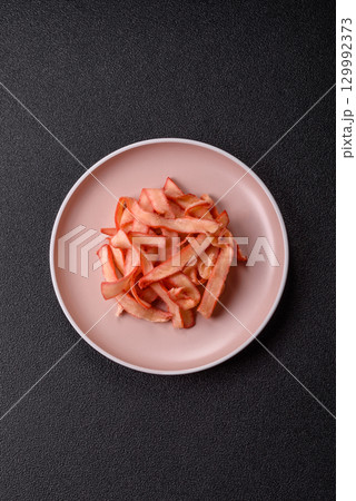 Food, dried squid in shavings or chopped as snacks or jerky. Snack dried squid for beer Food, dried squid in shavings or chopped as snacks or jerky. Snack dried squid for beer 129992373