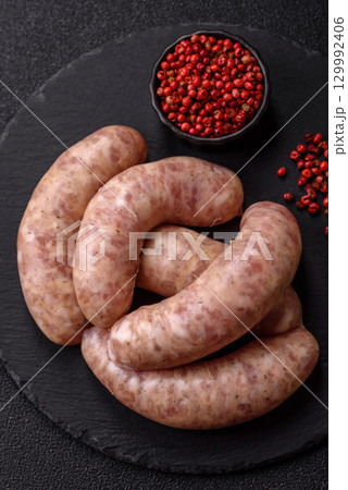 Raw meat sausages made from beef or pork, fresh meat for barbecuing or grilling. Raw sausages 129992406