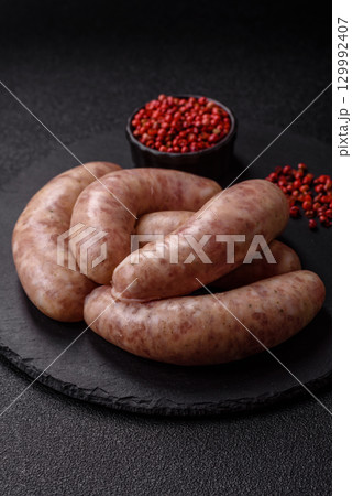Raw meat sausages made from beef or pork, fresh meat for barbecuing or grilling. Raw sausages Raw meat sausages made from beef or pork, fresh meat for barbecuing or grilling. Raw sausages 129992407