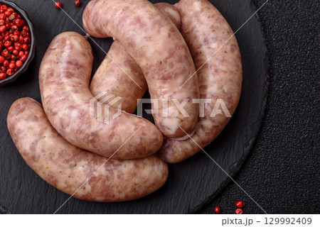 Raw meat sausages made from beef or pork, fresh meat for barbecuing or grilling. Raw sausages Raw meat sausages made from beef or pork, fresh meat for barbecuing or grilling. Raw sausages 129992409