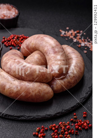 Raw meat sausages made from beef or pork, fresh meat for barbecuing or grilling. Raw sausages 129992411