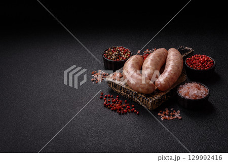 Raw meat sausages made from beef or pork, fresh meat for barbecuing or grilling. Raw sausages Raw meat sausages made from beef or pork, fresh meat for barbecuing or grilling. Raw sausages 129992416