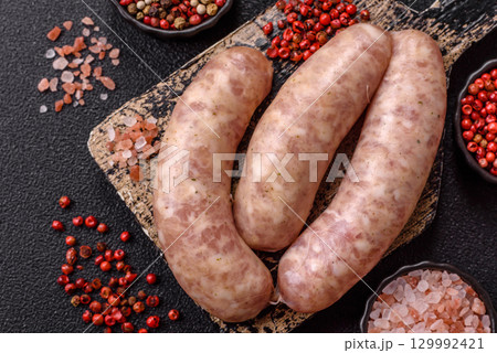Raw meat sausages made from beef or pork, fresh meat for barbecuing or grilling. Raw sausages Raw meat sausages made from beef or pork, fresh meat for barbecuing or grilling. Raw sausages 129992421